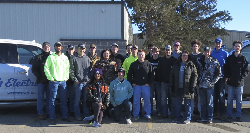 Electrician Program class poses for Muth Electric donation